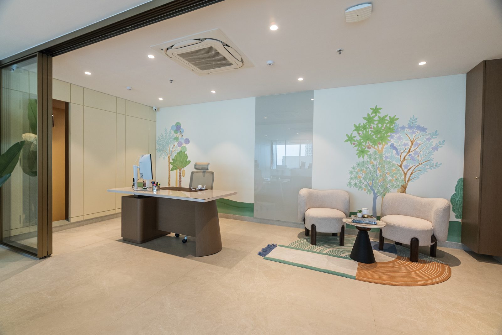 The reception desk between hand painted murals